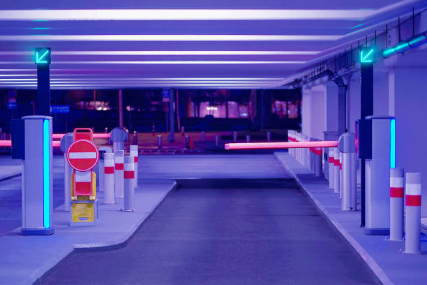 istockphoto-1223638438-612x612 Exit from underground parking. Underground parking garage. Barrier at Entrance and exit of a car Parking garage. barrier in a car park. Interior of parking